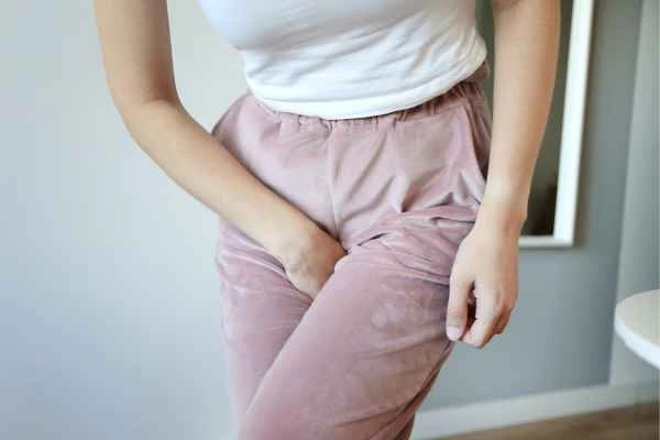 woman running for the toilet because of urinary incontinence Blackwall